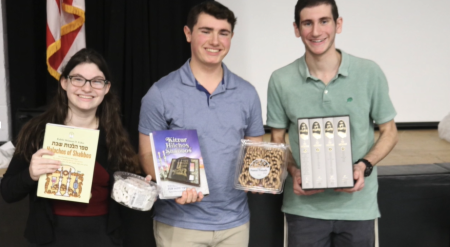 Elana Max (3rd place), Noam Traeger (2nd place), and Yishai Kaufman (1st place) with their prizes 